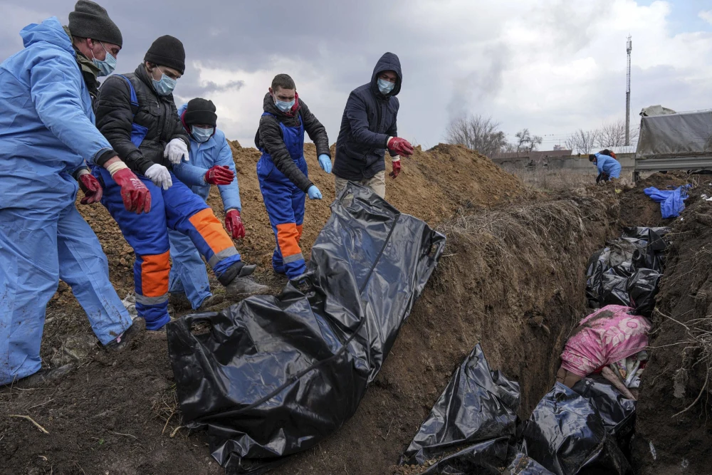 This image has an empty alt attribute; its file name is 220310-Mariupol-mass-grave-al-1004-f096b3.webp